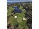 Aerial view of a lush golf course with water features, sand traps, and greens at 2617 Cove Cay Dr # 505, Clearwater, FL 33760