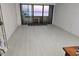 Bright living room featuring light hardwood floors and a balcony with beautiful water views at 2617 Cove Cay Dr # 505, Clearwater, FL 33760
