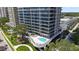 Luxury condo building with pool and lush landscaping at 2912 W Santiago St # 404, Tampa, FL 33629