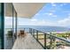 Spacious balcony with stunning water views and lounge chairs at 2912 W Santiago St # 404, Tampa, FL 33629