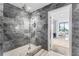 Bathroom with large walk-in shower and marble tile at 2912 W Santiago St # 404, Tampa, FL 33629