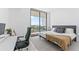 Modern bedroom with a king-size bed and access to a balcony at 2912 W Santiago St # 404, Tampa, FL 33629