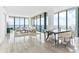 Elegant dining area with modern table and chairs, and water views at 2912 W Santiago St # 404, Tampa, FL 33629