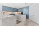 Modern kitchen with blue cabinetry and large marble island at 2912 W Santiago St # 404, Tampa, FL 33629