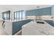 Stylish kitchen featuring blue cabinets, marble countertops, and water views at 2912 W Santiago St # 404, Tampa, FL 33629