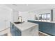 Modern kitchen with marble countertops and teal cabinetry at 2912 W Santiago St # 404, Tampa, FL 33629