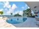 Resort-style pool with ample lounge chairs and stunning water views at 2912 W Santiago St # 404, Tampa, FL 33629