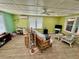 Multipurpose living area with a workspace and comfy seating at 3022 56Th S St, Gulfport, FL 33707