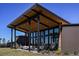Covered patio with modern furniture and a view of the surrounding landscape at 31210 Pendleton Landing Cir, Wesley Chapel, FL 33545