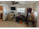 Living room with tiled floors and a ceiling fan at 3311 W Saint Conrad St, Tampa, FL 33607