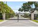 Elegant community gate at Dunedin Cove with brick pillars and iron gates at 34 Concord Dr, Dunedin, FL 34698
