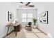 Home office with natural light, a wooden desk, artwork, and a minimalist aesthetic at 34 Concord Dr, Dunedin, FL 34698
