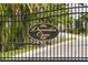 Close up of the Dunedin Cove community sign on an iron gate at 34 Concord Dr, Dunedin, FL 34698