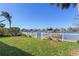 Spacious backyard with a view of the canal and private dock at 405 12Th Ave, Indian Rocks Beach, FL 33785