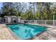 Inviting community pool with ample seating and a fenced area at 4331 Brooker Creek Dr, Palm Harbor, FL 34685