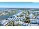 Aerial photograph showing waterfront community with multiple buildings and canals at 514 Garland Cir, Indian Rocks Beach, FL 33785