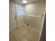 Laundry area with tile floor and window at 8305 N Brooks St, Tampa, FL 33604