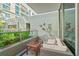 Private balcony with outdoor seating and lush landscaping at 912 Channelside Dr # 2320, Tampa, FL 33602