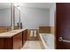 Double vanity bathroom with a large soaking tub and tile flooring at 912 Channelside Dr # 2320, Tampa, FL 33602