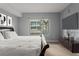 Bright bedroom with a king-size bed, large window, and media console at 912 Channelside Dr # 2320, Tampa, FL 33602