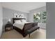 Spacious bedroom with a sleigh bed, large window, and a plush bench at 912 Channelside Dr # 2320, Tampa, FL 33602