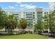 Modern dog park with artificial turf and palm trees, adjacent to a residential building at 912 Channelside Dr # 2320, Tampa, FL 33602