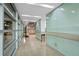 Bright hallway with modern finishes and glass walls at 912 Channelside Dr # 2320, Tampa, FL 33602