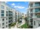 Inviting pool area with lush landscaping and residential building backdrop at 912 Channelside Dr # 2320, Tampa, FL 33602