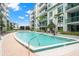 Community pool with surrounding patio at 912 Channelside Dr # 2320, Tampa, FL 33602