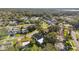 Wide aerial view of home and neighborhood, highlighting property location and landscape at 918 Windward Way, Palm Harbor, FL 34685