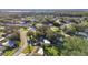 Wide aerial view showing the home's neighborhood, landscape, and waterfront proximity at 918 Windward Way, Palm Harbor, FL 34685