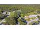 Aerial view of residential neighborhood showcasing homes and lush green landscape at 918 Windward Way, Palm Harbor, FL 34685