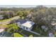 Aerial view of the house and backyard, showing landscaping and neighborhood context at 918 Windward Way, Palm Harbor, FL 34685