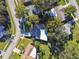 Aerial view of house and surrounding neighborhood, showcasing landscape and location at 918 Windward Way, Palm Harbor, FL 34685