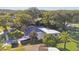 Aerial view showing home's location, landscaping, and neighborhood at 918 Windward Way, Palm Harbor, FL 34685