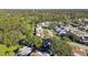 Aerial view showcasing the home's location within a residential neighborhood near a waterfront at 918 Windward Way, Palm Harbor, FL 34685