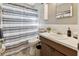 Clean bathroom with shower/tub combo, vanity, and updated fixtures at 918 Windward Way, Palm Harbor, FL 34685