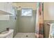 Clean bathroom with walk-in shower and window at 918 Windward Way, Palm Harbor, FL 34685