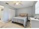 Well-lit bedroom with a comfortable bed and abundant closet space at 918 Windward Way, Palm Harbor, FL 34685