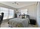 Bedroom with a double bed, dresser, and large window at 918 Windward Way, Palm Harbor, FL 34685