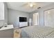 Spacious bedroom with a queen bed, dresser, and large closet at 918 Windward Way, Palm Harbor, FL 34685