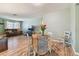 Bright dining area with a small table and chairs, adjacent to the living room at 918 Windward Way, Palm Harbor, FL 34685