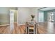 Simple dining area with a small table and chairs, near the kitchen at 918 Windward Way, Palm Harbor, FL 34685