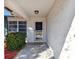 Front entry with a glass door and neutral color scheme at 918 Windward Way, Palm Harbor, FL 34685