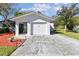 One-story home with attached garage and a well maintained yard at 918 Windward Way, Palm Harbor, FL 34685