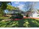 Ranch style home with a landscaped yard and attached garage at 918 Windward Way, Palm Harbor, FL 34685