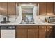 Kitchen sink and counter with wood cabinets at 918 Windward Way, Palm Harbor, FL 34685