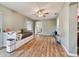Open living area with a daybed and view into the kitchen at 918 Windward Way, Palm Harbor, FL 34685