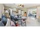 Comfortable living area with sectional sofa and sliding doors to patio at 918 Windward Way, Palm Harbor, FL 34685