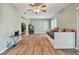 Living room with hardwood floors and a daybed at 918 Windward Way, Palm Harbor, FL 34685